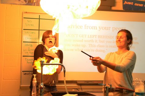 Science teacher Leah Rutkowski lights up the room during a chemistry lab.