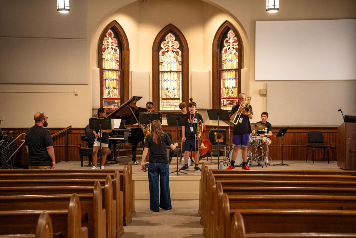 Program leader and Jazz Professor Colleen Clark educates the jazz campers after practicing a song. Through her teaching, Clark has realized the talent that these students possess, "These cats are killing it, they're great," Clark said, "they're eating everything up."